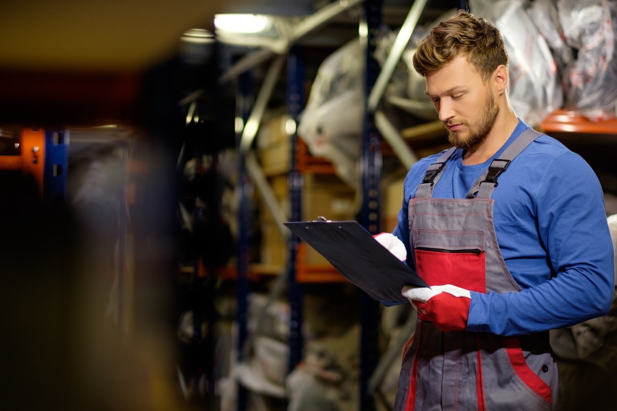 Worker on a automotive spare parts warehouse